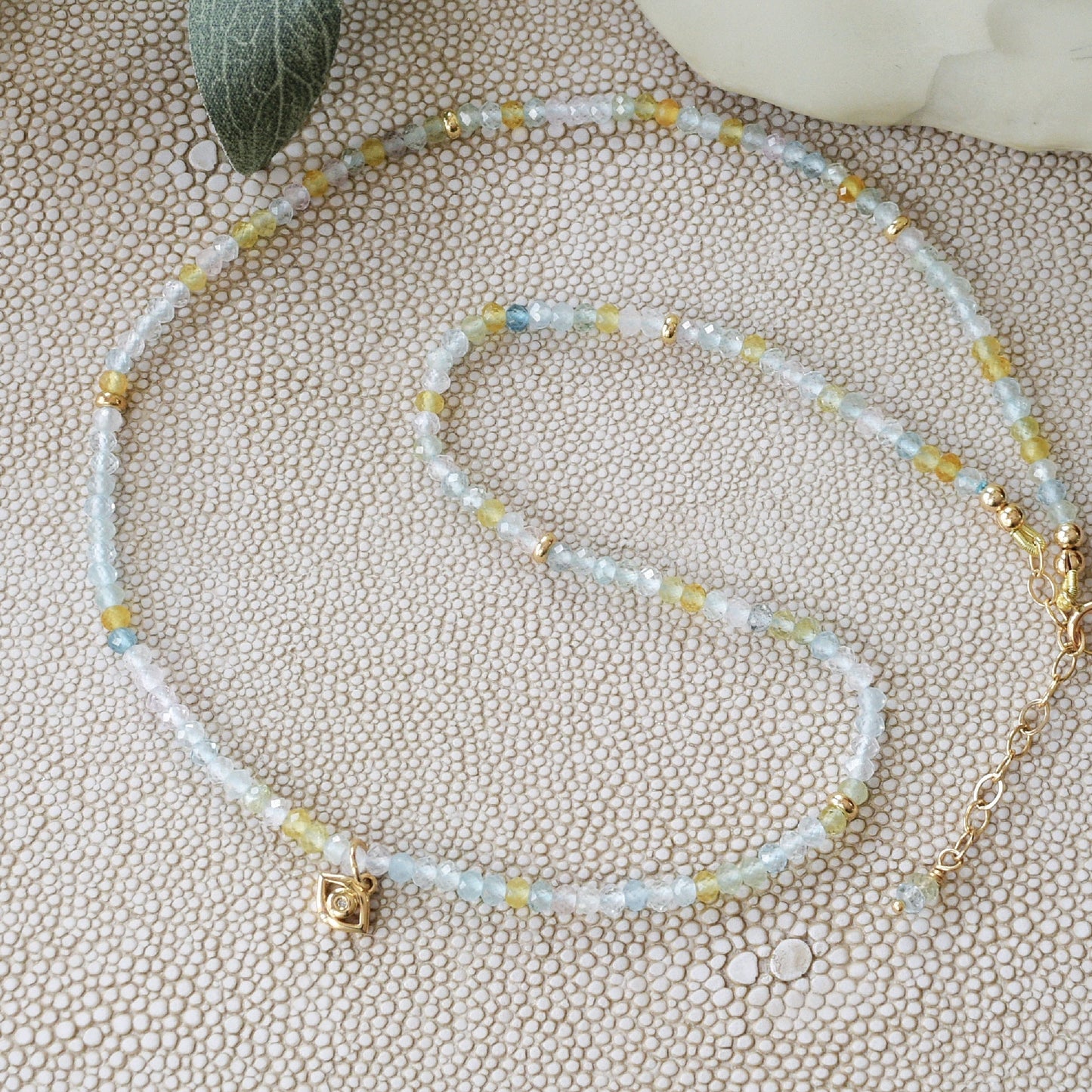 Aquamarine and gold beaded necklace with diamond Eye of Horus charm