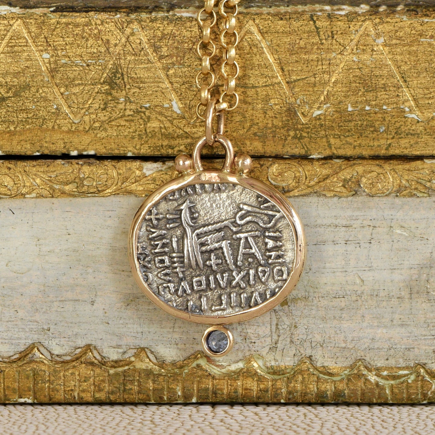 Back of Parthian Coin and Sapphire Pendant