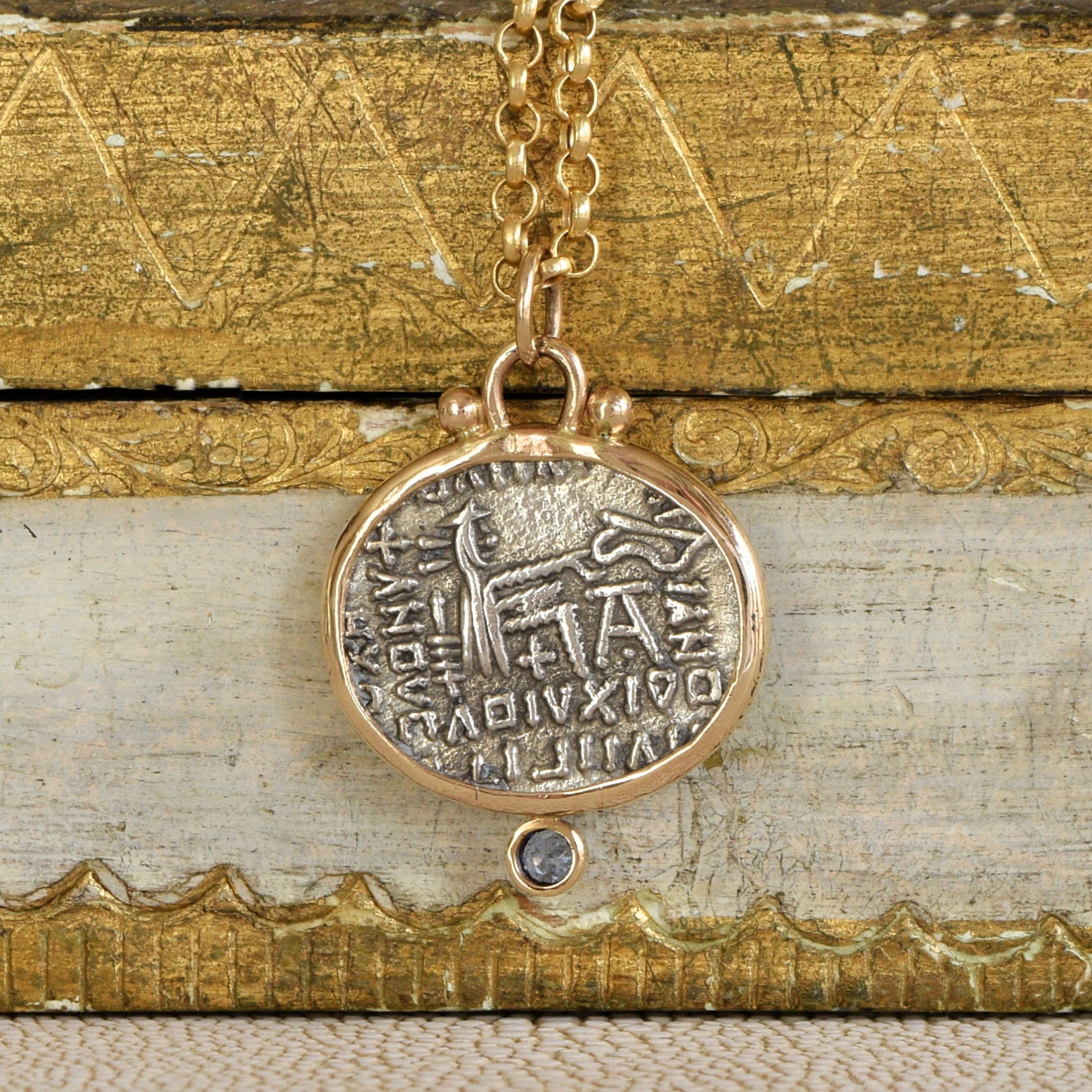 Back of Parthian Coin and Sapphire Pendant