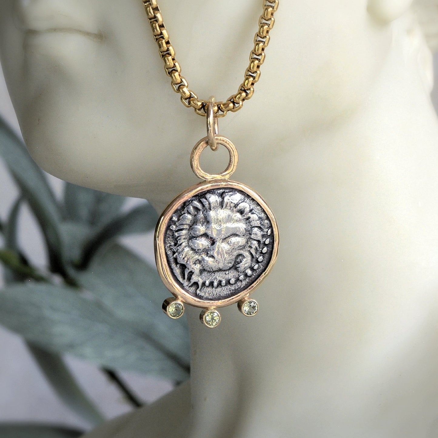 Lion coin pendant with gold and peridot