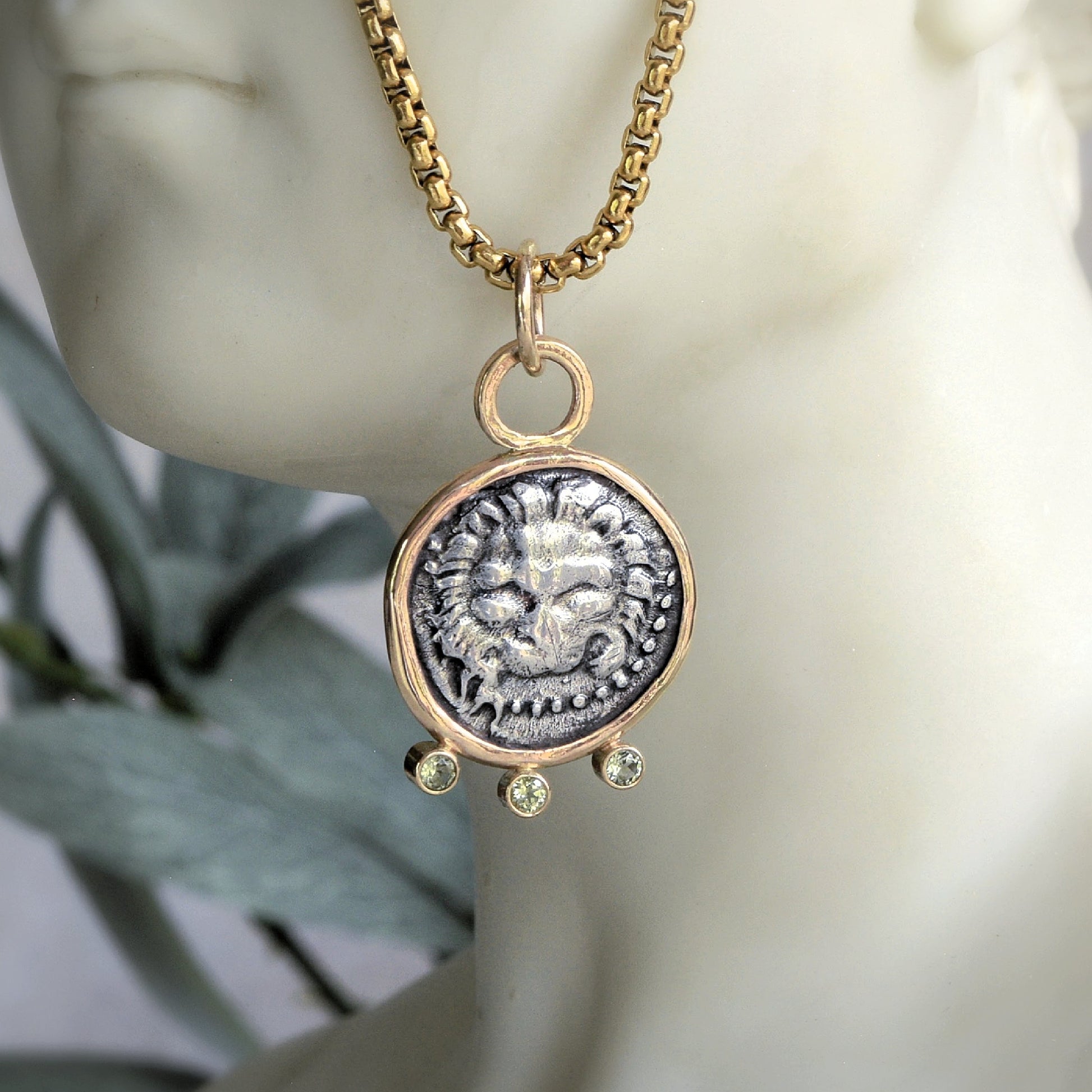 Lion coin pendant with gold and peridot