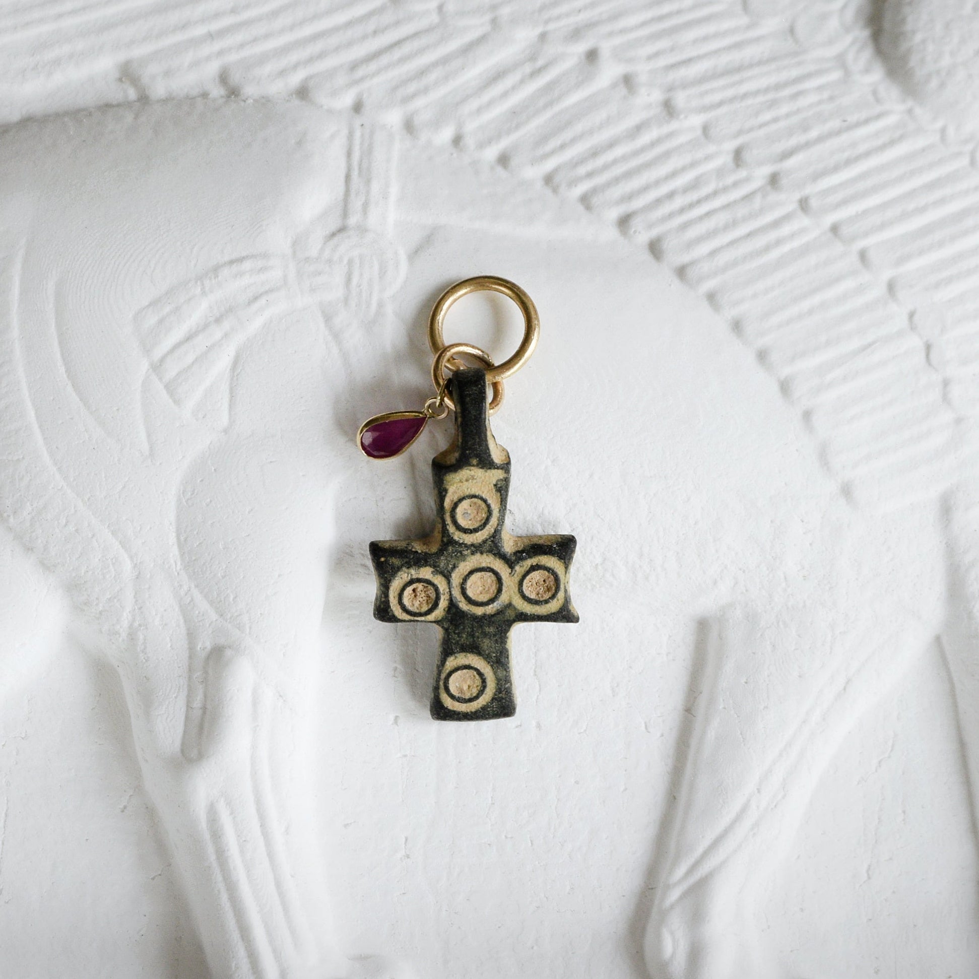 midevil cross amulet with ruby gemstone and gold bail
